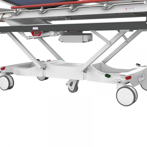 <h5 class="lightbox-heading">E-Point steering</h5>A perfectly centred steer wheel ensures the stretcher always accurately tracks and turns.<div class="d-none d-lg-block">Operated by a very light touch pedal action, this wheel positively pre-loads onto the floor to ensure strong grip and rides up and down effortlessly over bumps and hollows to keep traction. Turning left or right from either end gives the same steering result.</div>
